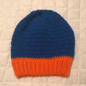 Handmade Crochet hat. Never worn. Blue and orange in color.